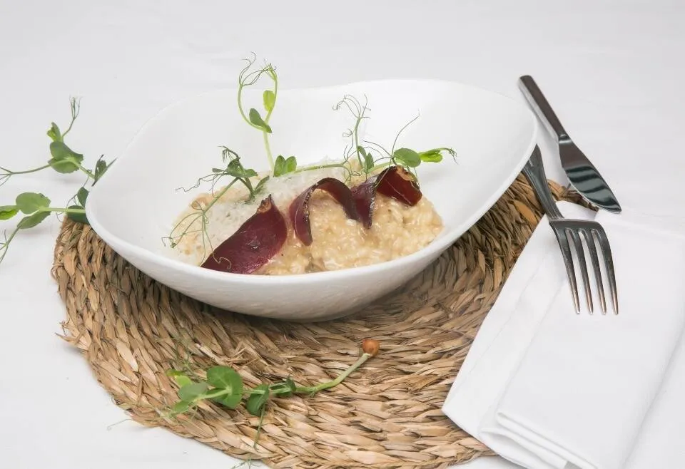 Arroz cremoso de boletus con jamón de pato