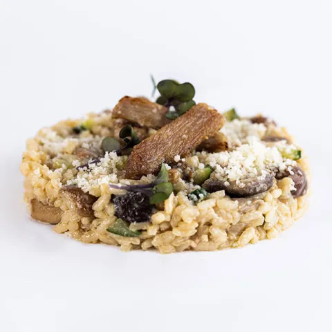 Arroz meloso de secreto ibérico, setas y parmesano